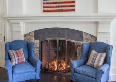 plaid pillow, american flag, fireplace, slipcover, chair cover, blue chair, kitchen design, stone fireplace, upholstery